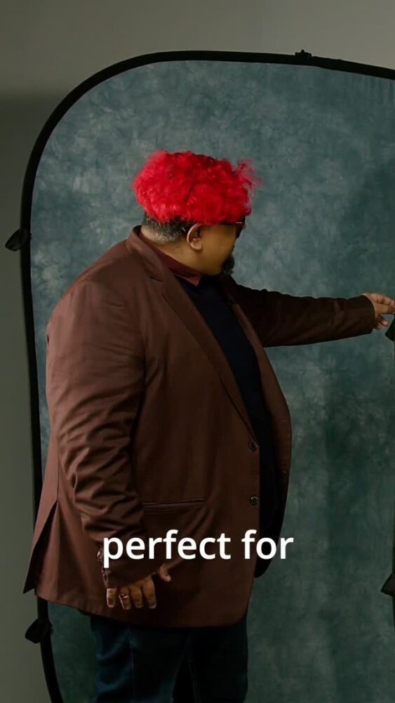 Portrait of a man with bright red hair and a brown blazer standing in a photography studio backdrop, with the words 'perfect for' overlaying the lower portion.