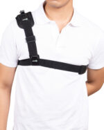 Black cross-shoulder strap with Aries logo resting on a white polo shirt, close-up on chest/shoulder area.