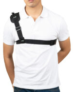 Man wearing a black shoulder harness crossing his white polo shirt, showing a chest strap.