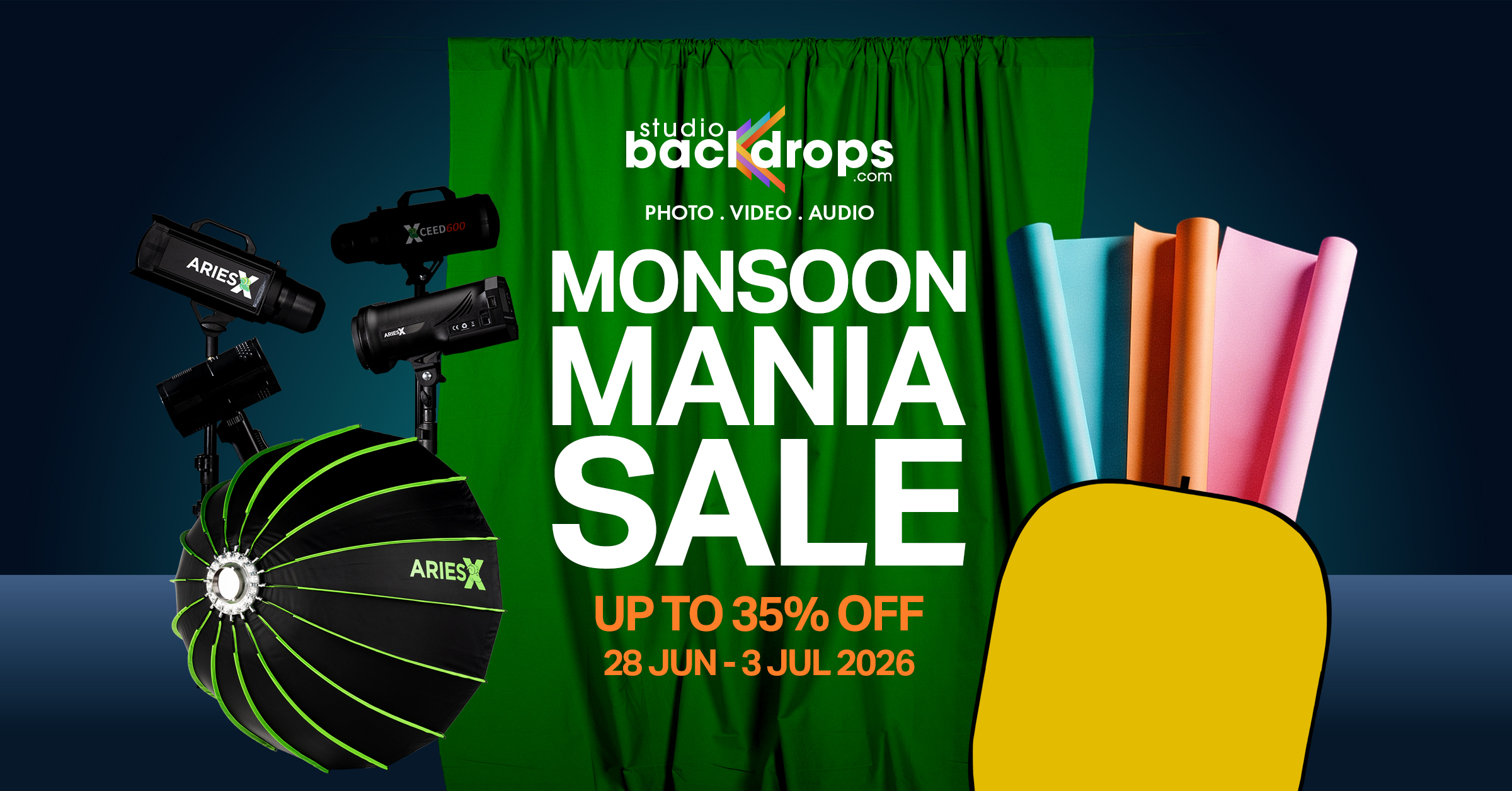 Green curtain backdrop with studio lights and bold 'MONSOON MANIA SALE' text; up to 35% off, June 28–July 3, 2026.